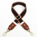 Detail of adjustable woven bag strap with geometric patterns and gold metal lobster clasps - Coffee and Brown