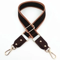 Detail of adjustable wide nylon shoulder strap with brown geometric pattern and gold hooks - Coffee & Coffee