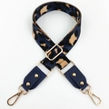 Close-up of leopard print crossbody bag strap with gold metal hooks and blue leather - Dark Blue + Blue Leather