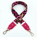 Macro shot of rose leopard print bag strap with golden metal buckles and leather ends - Rose Red + Rose Red Leather