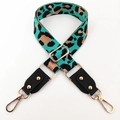 Detail of adjustable leopard print bag strap with turquoise pattern and gold lobster clasps - Emerald Green + Black Leather