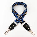 Detail of adjustable leopard print bag strap with gold metal buckles and black leather ends - Royal Blue + Black Leather