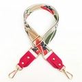 Close-up of a wide floral jacquard bag strap with pink leather ends and gold metal hooks - Rose Red