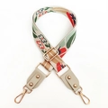 Close-up of colorful floral jacquard wide bag strap with gold metal hooks and adjuster - Beige Grey Leather