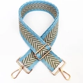 Macro shot of 5cm wide blue and green chevron woven strap with gold metal buckles - Orchid Green / Silver Clasp