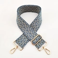 Detail of adjustable woven shoulder strap with blue geometric pattern and gold hardware - L2 Blue