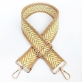 Detail of yellow and white V-patterned wide shoulder strap with gold metal lobster clasps - Yellow/White