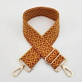 Close-up of adjustable woven shoulder strap with yellow red geometric pattern and gold hardware - L8 Yellow Wine Red