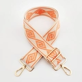 Detail of bohemian geometric diamond woven strap with polished gold-tone lobster clasps - Beige Base Orange Diamond / Silver Clasp