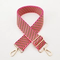 Close-up of a 5cm wide colorful jacquard woven bag strap with golden metal hardware - Rose Pink