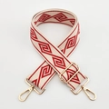 Detailed view of red and beige geometric pattern weaving on wide canvas shoulder bag strap - Beige Base Red Diamond / Silver Clasp