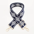Detail of adjustable wide woven strap with navy diamond pattern and gold metal hooks - Navy Blue Base White Diamond / Silver Clasp