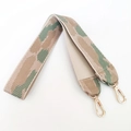 Close-up of thick woven nylon bag strap with gold lobster clasps in camouflage pattern - Khaki Green