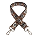Close-up of ethnic embroidered bag strap with geometric snowflake pattern and metal buckles - Brown Gunmetal Buckle