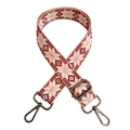 Macro detail of red and white ethnic geometric pattern woven bag strap with swivel hooks - Pink Gunmetal Buckle