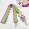 Detail of crochet rainbow bag strap with colorful handmade flowers and gold metal clips - Rainbow Long Style