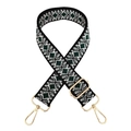 Close-up of geometric diamond pattern jacquard strap with gold metal swivel lobster hooks - Black White Green