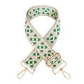 Close-up of wide jacquard bag strap with green geometric pattern and gold hardware - Beige White Green Pattern