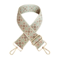 Close-up of jacquard woven geometric patterns on wide adjustable strap with gold buckles - F10-Beige Base Green Nude Pink Flower