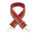 Close-up of adjustable colorful striped canvas bag strap with golden metal lobster clasps - Red Brown