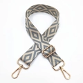 Detail of adjustable bag strap with grey diamond embroidery and gold metal lobster clasps - Beige Base Grey