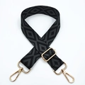Close-up of geometric diamond pattern embroidery on adjustable wide bag strap with gold buckle - Black Base Dark Gray