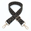 Detail of adjustable black and gold geometric embroidered bag strap with metal lobster clasps - Silver Clasp / Black Base Dark Khaki