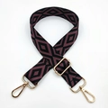 Close-up of purple geometric diamond embroidery on bag strap with gold metal swivel hooks - Metallic Purple Black