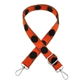 Detail of adjustable bag strap with bold black polka dots on vibrant orange canvas - Black and Orange With Silver Buckle
