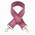 Close-up of ethnic jacquard purse strap with pink geometric patterns and gold metal hooks - No. 9 Rose Red Pink Khaki