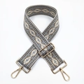 Detail of 5cm ethnic jacquard wide strap with golden metal lobster clasps and buckle - No. 15 Grey Base Khaki