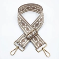 Detail of bohemian geometric jacquard bag strap with golden metal hardware adjusters - No. 17 Beige Base Dark Pink