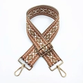 Close-up of geometric jacquard bag strap with gold metal buckles and adjustable slider - No. 18 Brown Base Dark Khaki