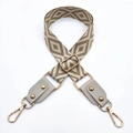 Detail of adjustable geometric jacquard bag strap with leather ends and gold metal buckles - Silver Clasp / Beige Base Khaki + Beige Gray Leather