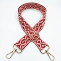 Detail of red and cream geometric jacquard woven bag strap with gold metal lobster clasps - Red + Gold Buckle