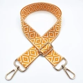 Detail of adjustable orange and white geometric jacquard shoulder strap with gold hooks - Yellow