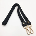 Detail of hand-woven black knit bag strap with gold rivets and lobster clasps - 80cm / Black