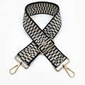 Detailed view of 5cm ethnic jacquard wide shoulder strap with gold metal swivel snap hooks - Silver Clasp / Sesame Black Gray