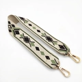 Close-up of ethnic woven bag strap with green geometric patterns and gold lobster clasps - 55cm / Coffee Diamond