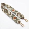 Close-up of geometric pattern guitar strap for bags with gold-tone swivel lobster clasps - Brown Squares