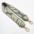 Close-up of sage green leopard jacquard strap with golden rotating lobster clasps - Beige Green Elephant