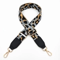 Close-up of leopard print wide strap with gold metal lobster clasps and adjustment buckle - Grey Leopard