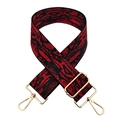 Detail of wide red and black abstract pattern bag strap with gold metal hardware - Silver Clasp / Red