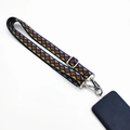 Detail of bohemian geometric pattern phone strap with adjustable metal buckle and clasp - Argyle
