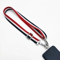 Macro detail of tricolor striped phone lanyard with durable silver metal buckles - Red/White/Blue