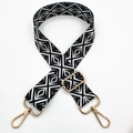 Detail of black and white geometric diamond pattern bag strap with gold lobster clasps - Black Diamond Pattern