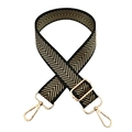 Macro shot of adjustable wide bag strap featuring black gold chevron weave and golden hardware - Black Gold Thread