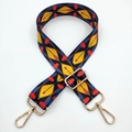 Close-up of colorful ethnic geometric wide bag strap with gold metal lobster clasps - Yellow Leaf Arrow