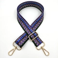 Close-up of geometric ethnic bag strap with purple patterns and gold metal lobster clasps - Blue Purple Ethnic