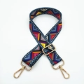 Close-up of adjustable ethnic geometric pattern canvas strap with gold metal hooks - Ethnic Geometric Patchwork